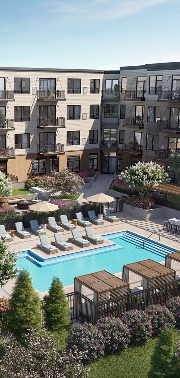 Apartment pool courtyard with lounge chairs, cabanas, landscaping, and private balconies